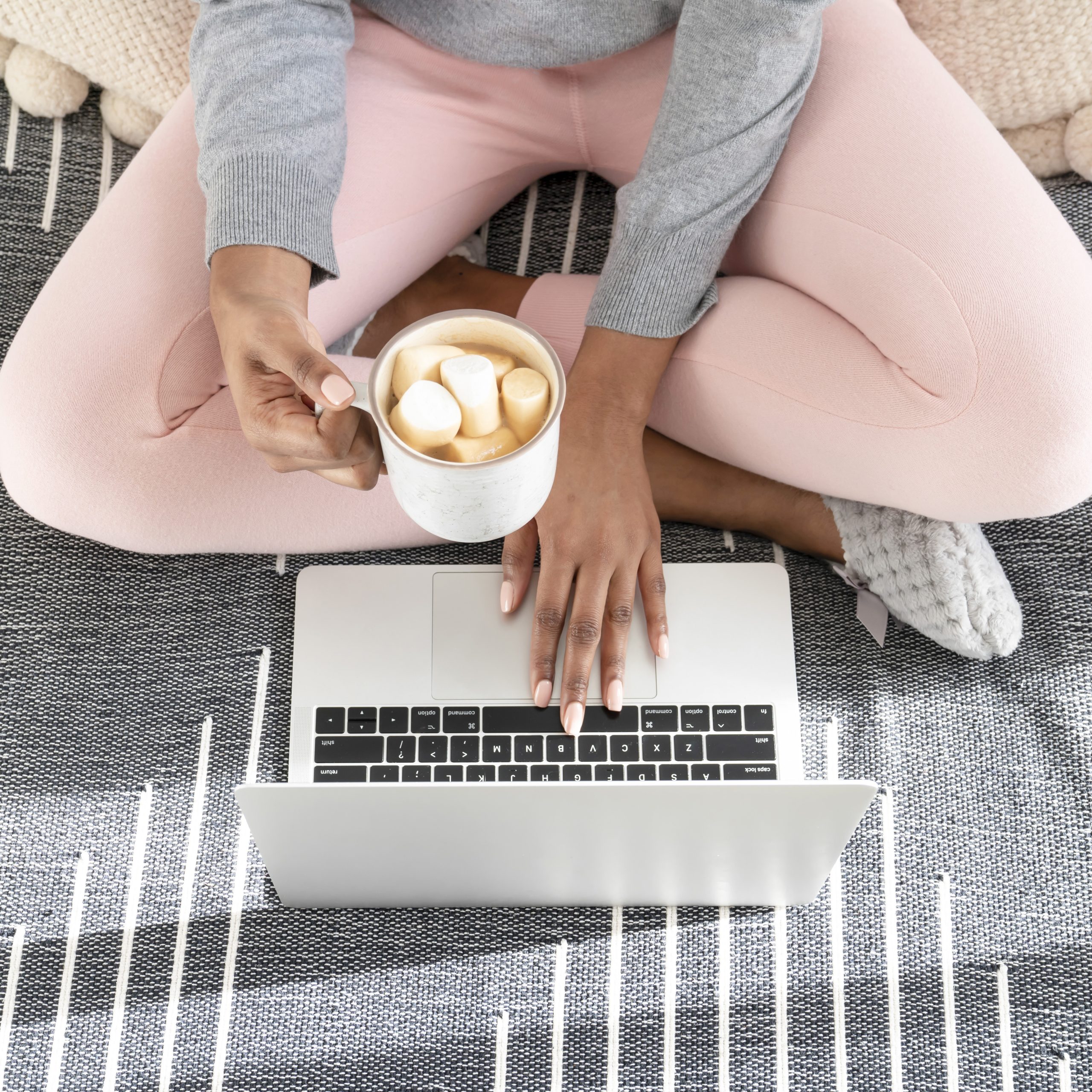 woman with laptop and cup of coffee